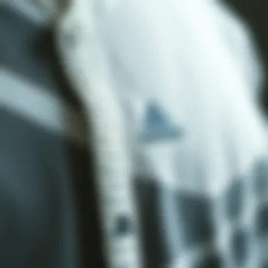 Detail of fabric and design elements in Adidas cardigan