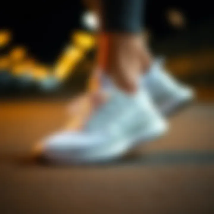 A stylish pair of white running shoes showcasing their sleek design.